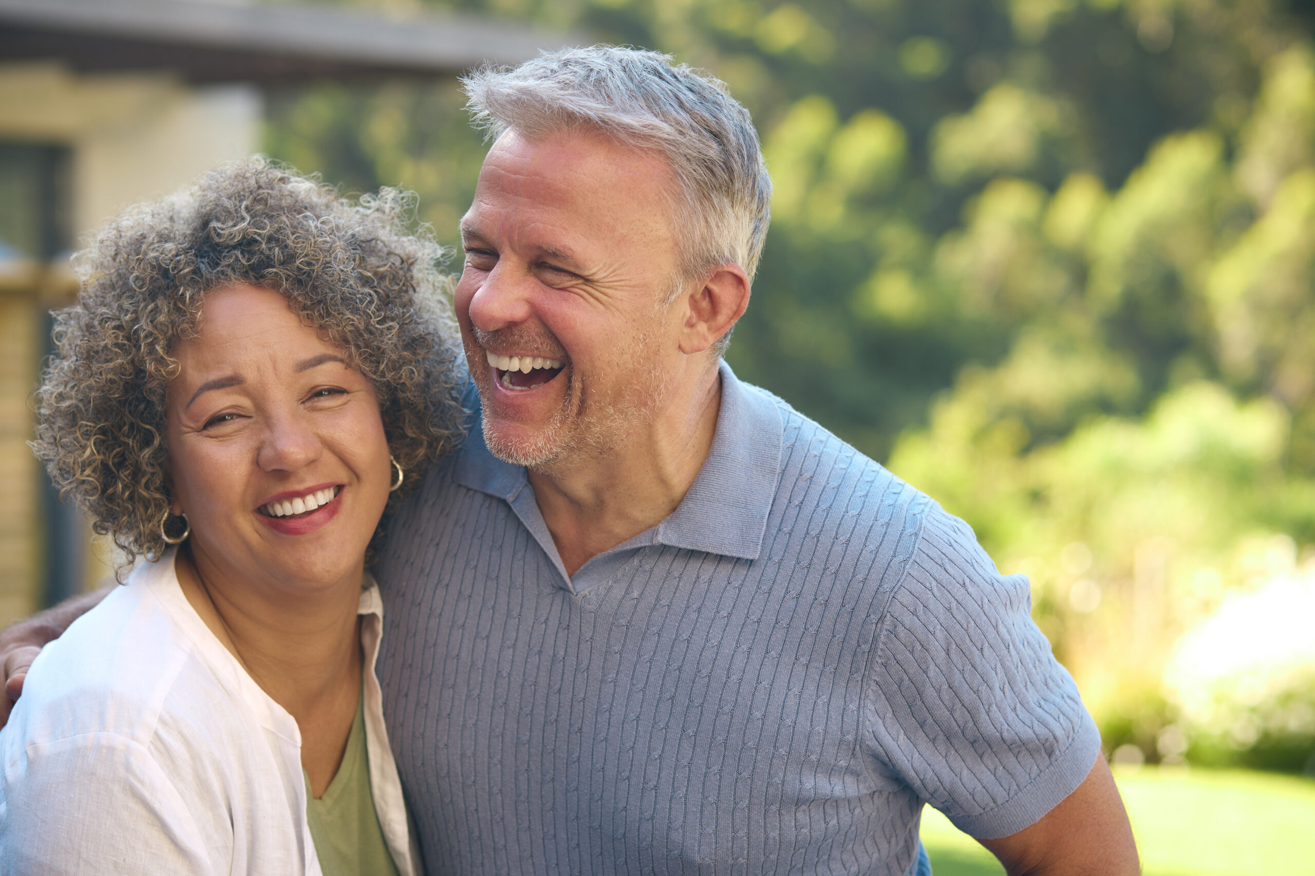 Two residents laughing together outdoors at United Lifestyle Resort Traralgon